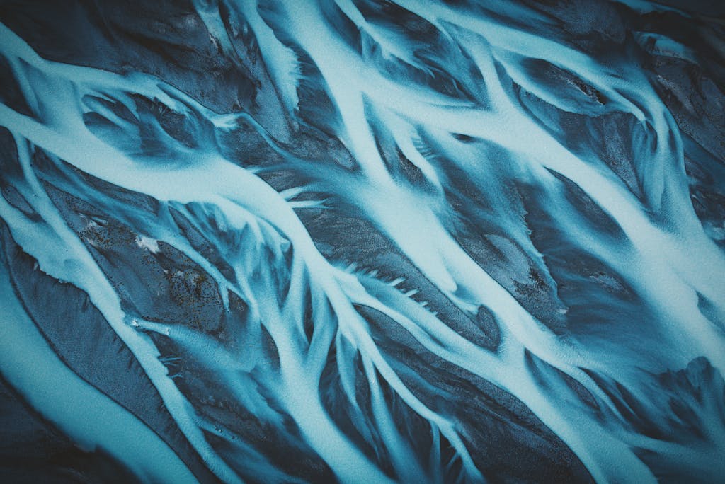 Stunning aerial view of abstract river patterns at Tasman River, New Zealand.